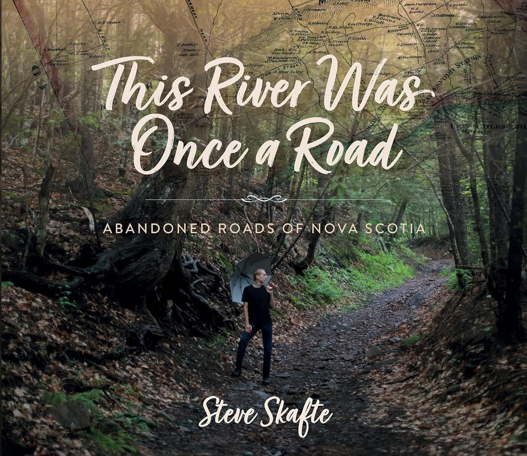 Title Image with picture of person standing on old roadway with forest on both sides of the road. The text reads This River Was Once a Road - ABANDONED ROADS OF NOVA SCOTIA - Steve Skafte